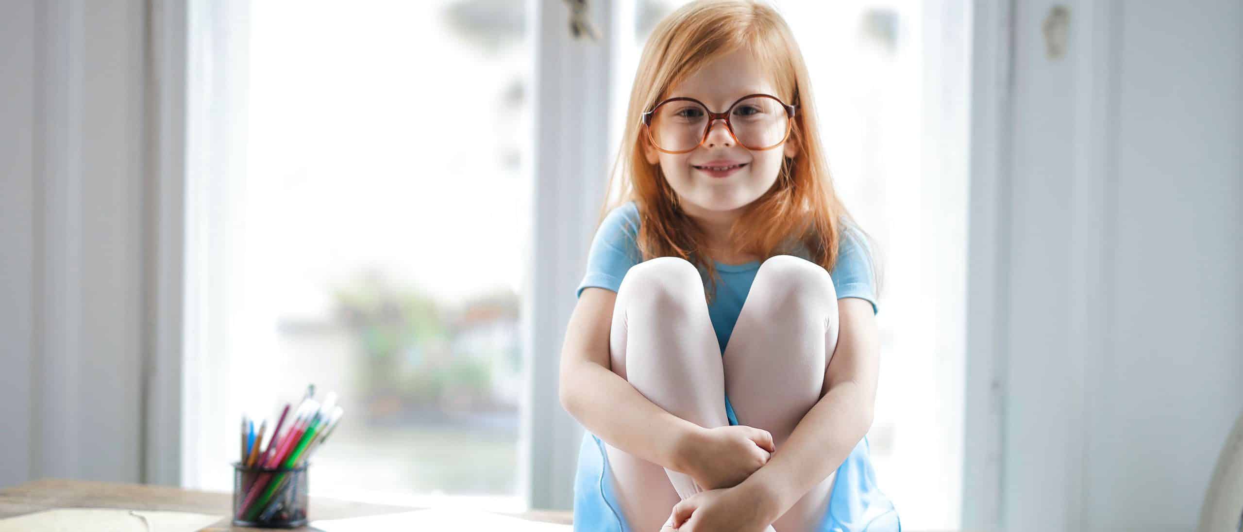 Girl with glasses sitting banner-11